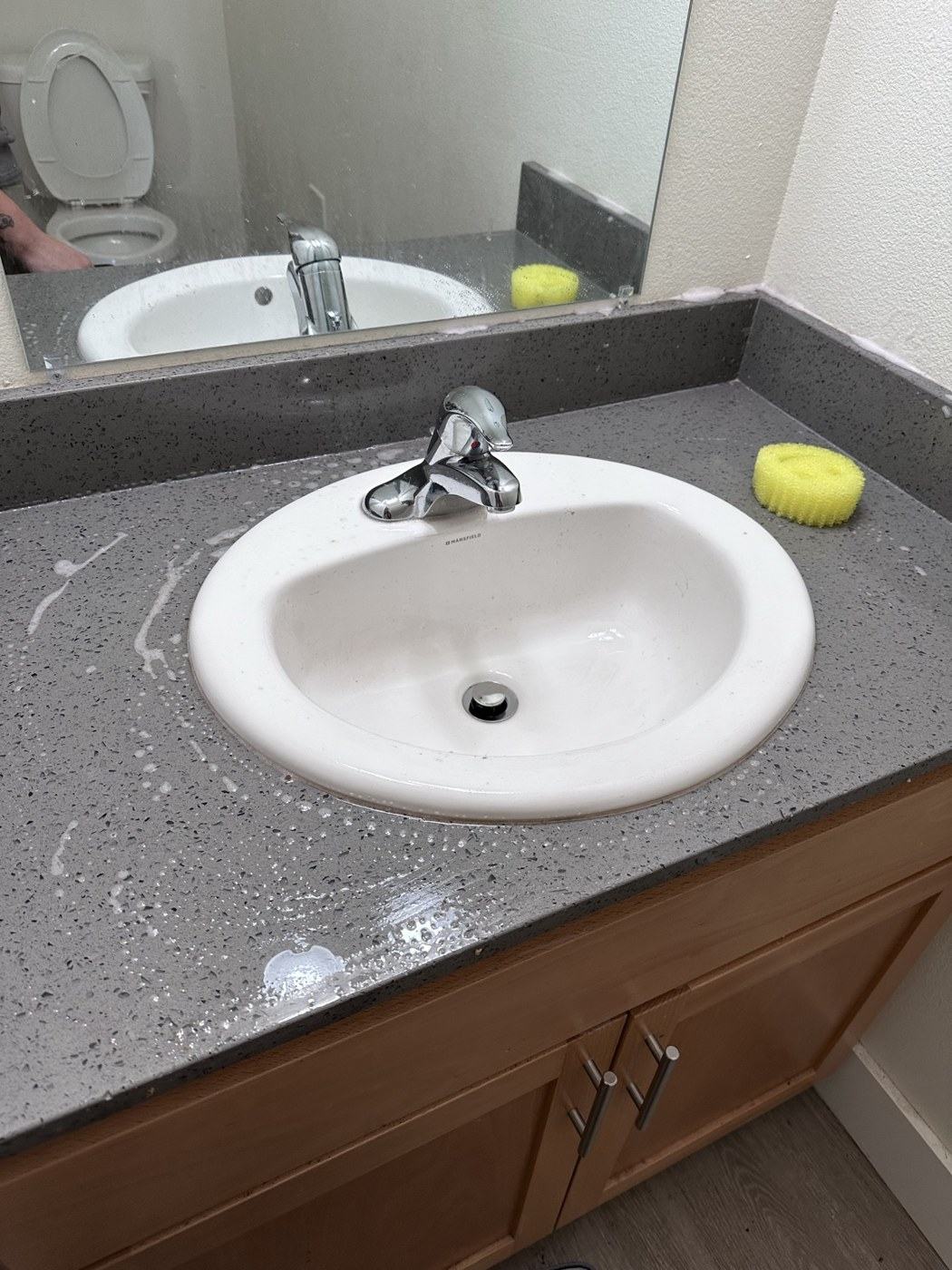 Sink, counter and mirror, during cleaning