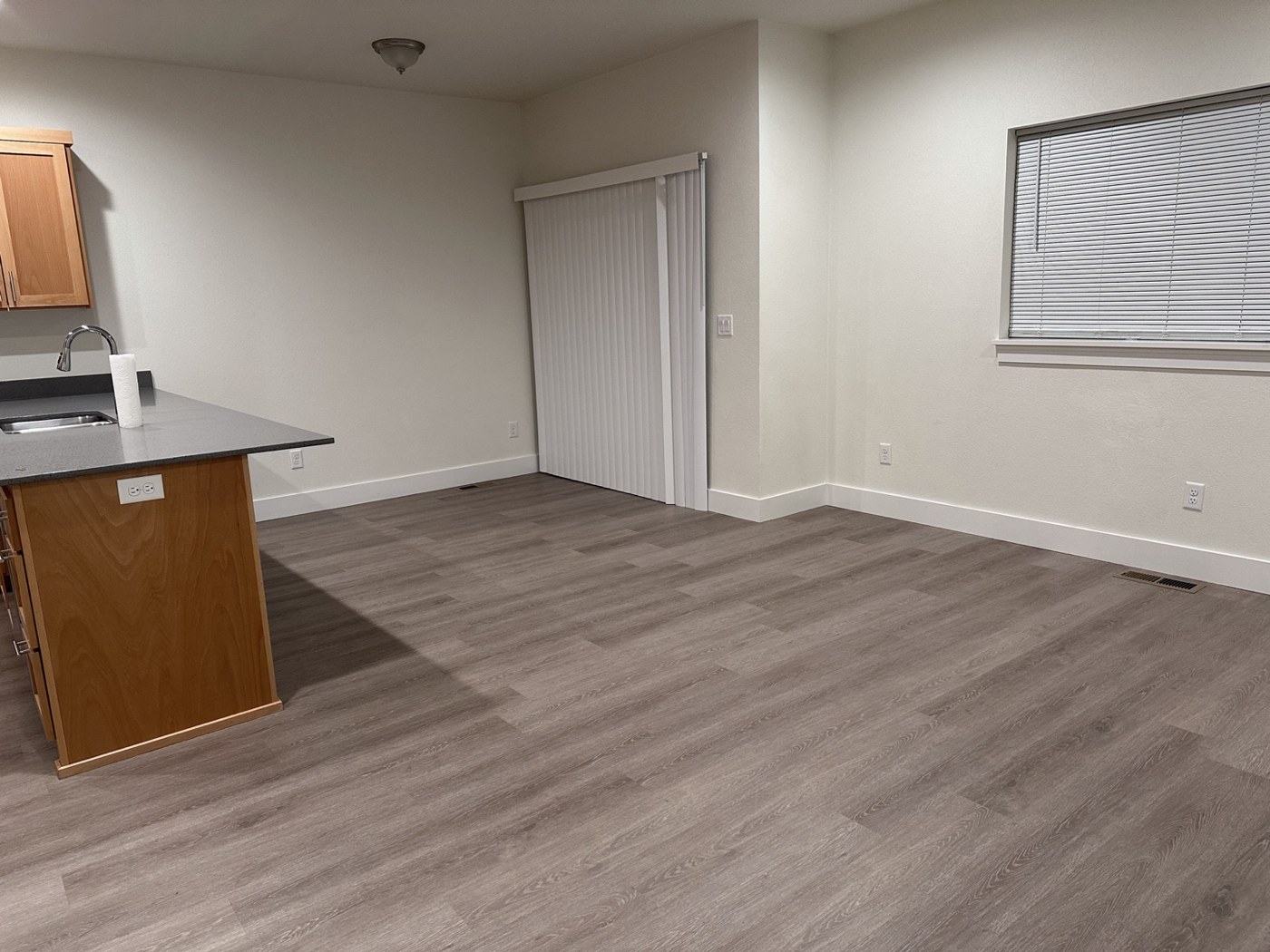 An empty kitchen and dining area, ready for its next use.