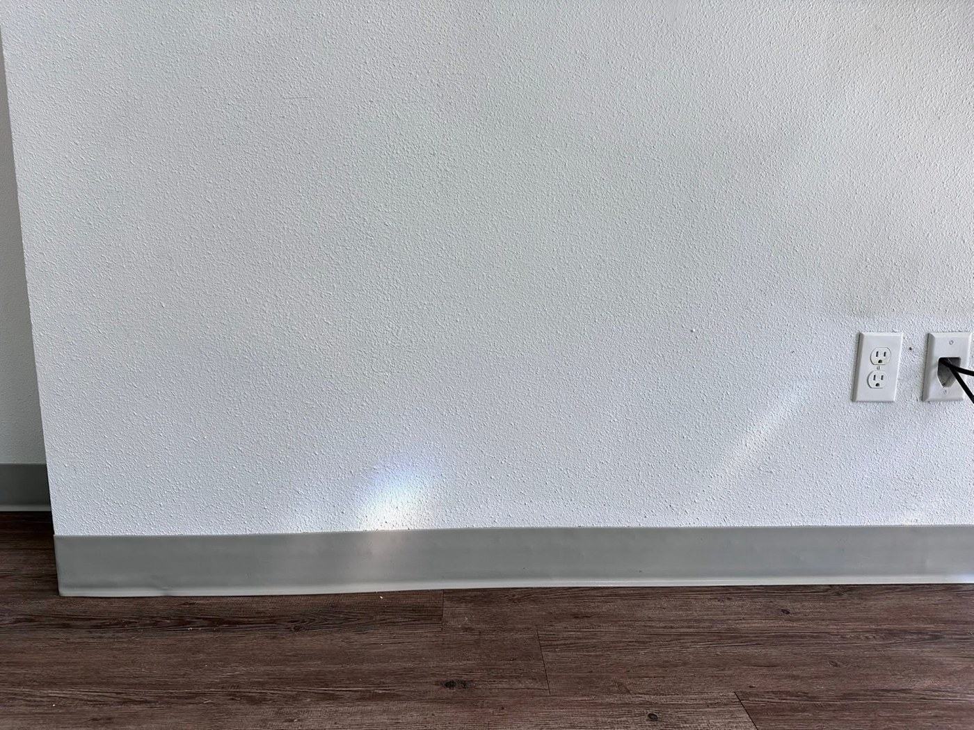 Wall and baseboard after cleaning